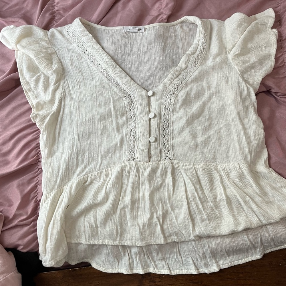 Beige top. High to low fitting. Thin material perfect for warm weather